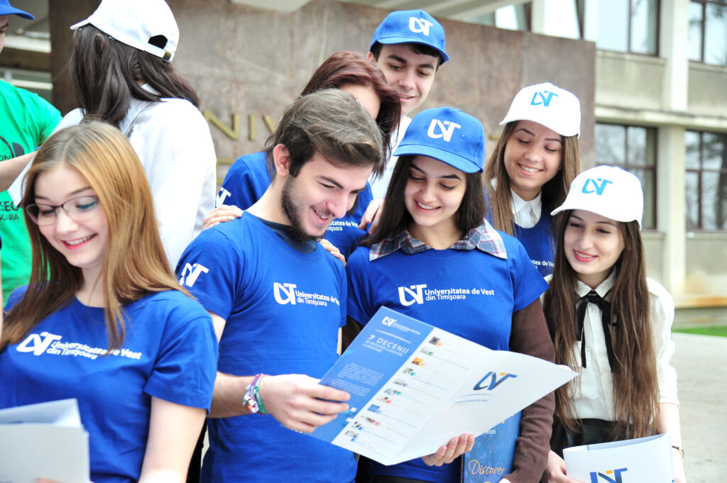 students reading a West University of Timisoara promotional flyer